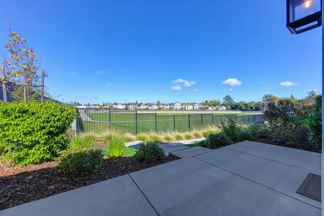 a view of a lake with a house in the background