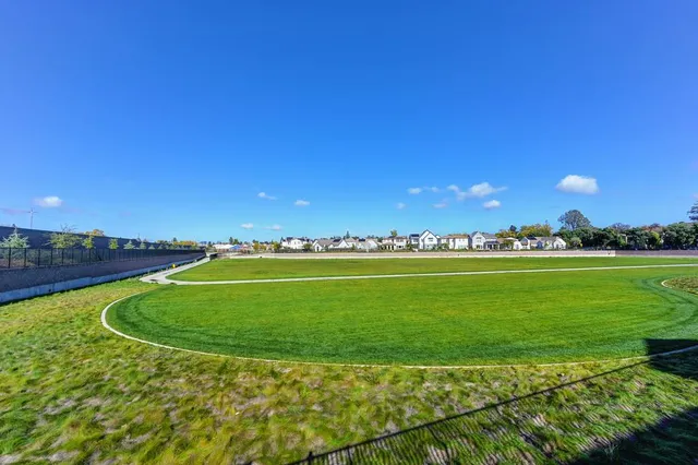 a view of a golf course with a lake
