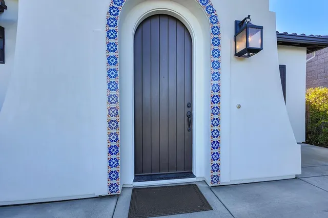 a view of an entryway with wooden floor