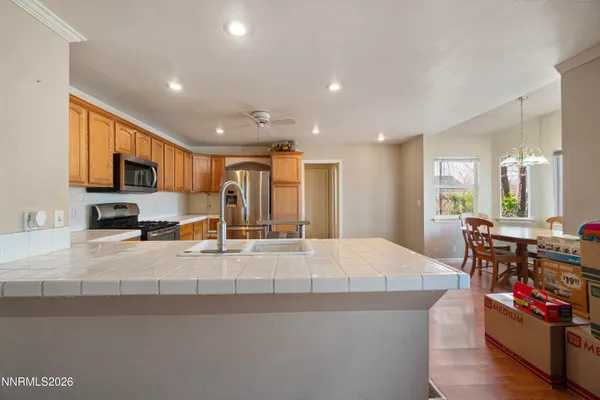a large white kitchen with lots of counter top space