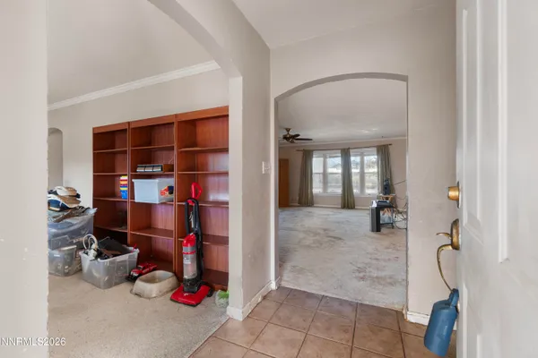 a room with lots of white furniture and gym equipment