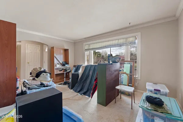 a living room with furniture rug and a window