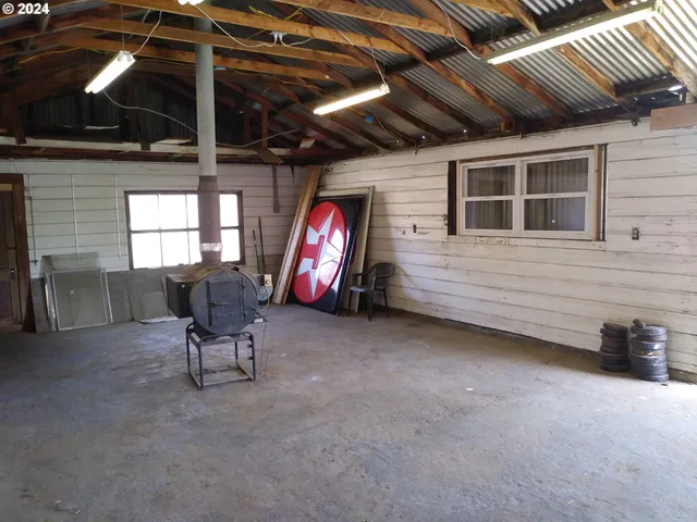 a view of a room with furniture and a window