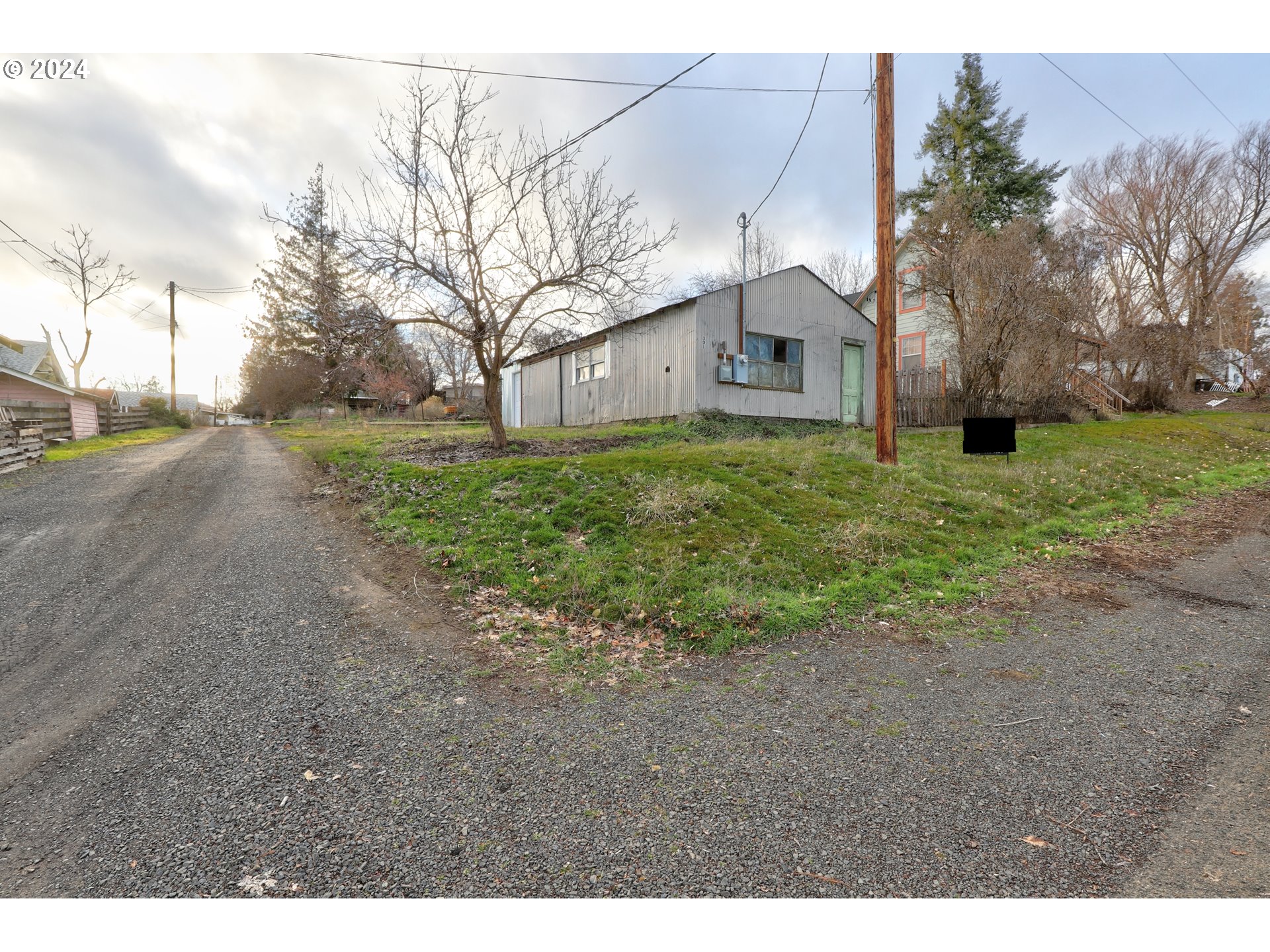 301 2nd Street Moro, OR 97039 - Photo 8 of 8 a front view of a house with a yard and garage