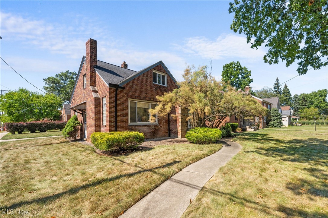 18122 Nottingham Road Cleveland, OH 44119 - Photo 1 of 29 Front of home featuring a front lawn, and a brick siding