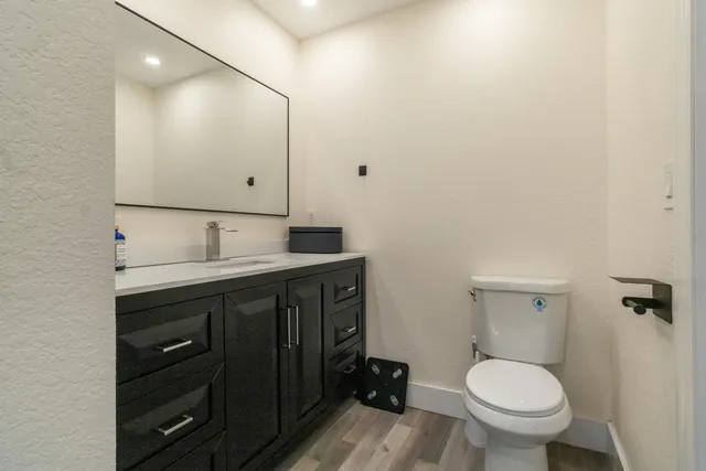 a bathroom with a glass shower door
