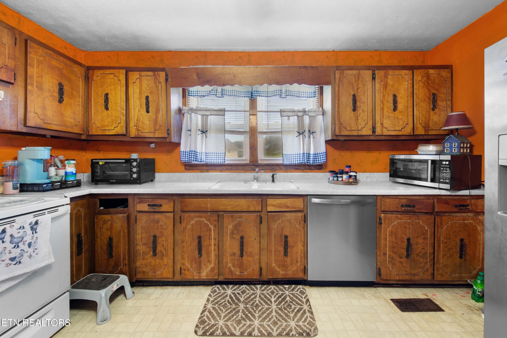 385 Hubbs Grove Road Maynardville, TN 37807 - Photo 11 of 33 a kitchen with stainless steel appliances granite countertop a sink a stove and a refrigerator