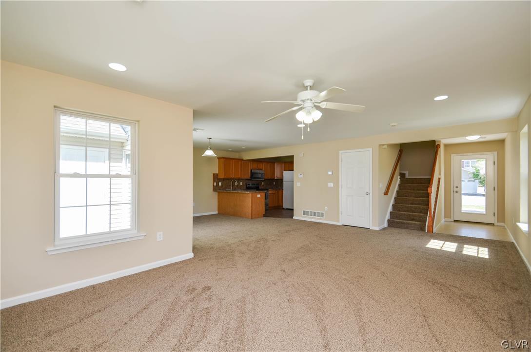 121 Sciota Garden Road Sciota, PA 18354 - Photo 4 of 31 an empty room with windows and ceiling fan