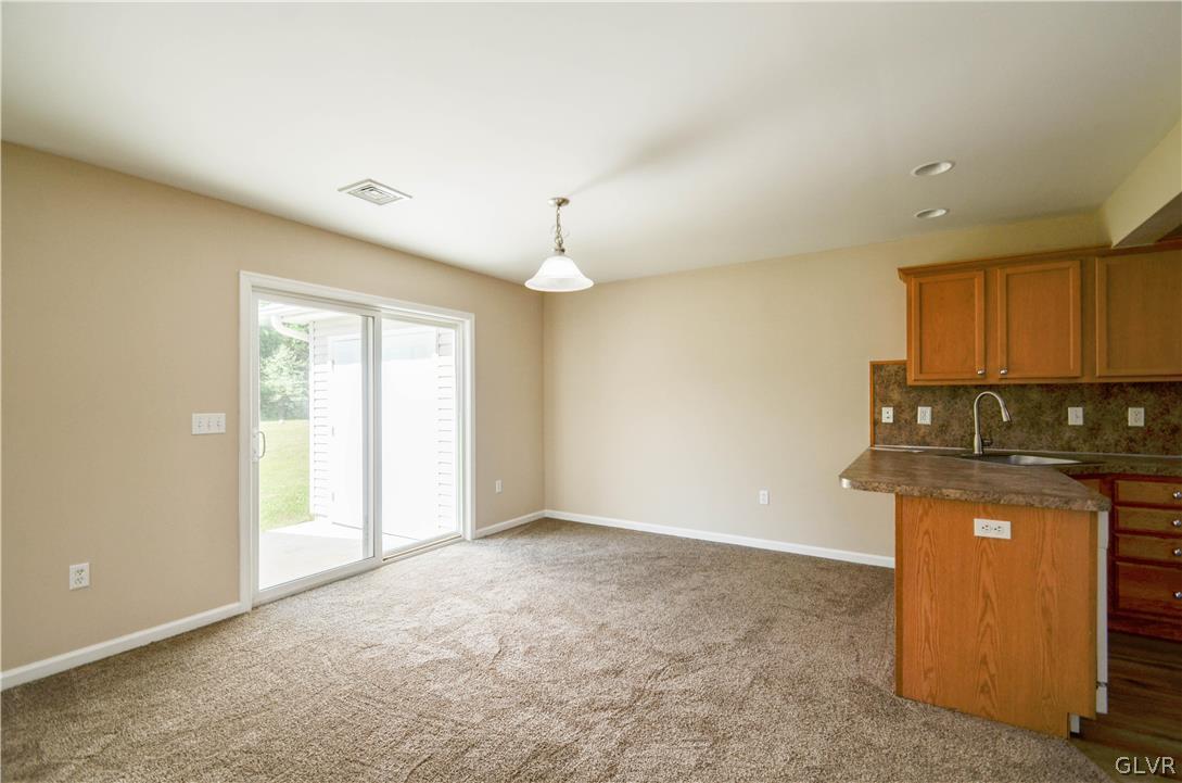 121 Sciota Garden Road Sciota, PA 18354 - Photo 6 of 31 an empty room with kitchen view and a window