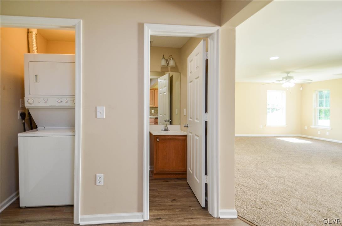 121 Sciota Garden Road Sciota, PA 18354 - Photo 10 of 31 a view of a hallway with wooden floor and a bathroom