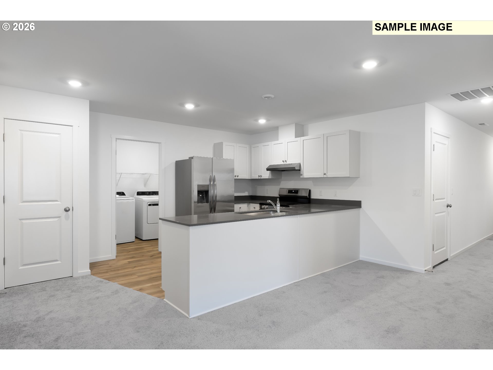 25255 Tanglewood Way Veneta, OR 97487 - Photo 13 of 47 a kitchen with stainless steel appliances kitchen island sink refrigerator and microwave