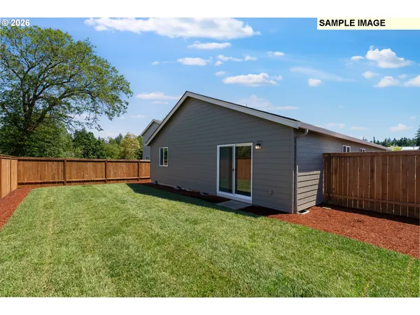 a backyard of a house with lots of green space