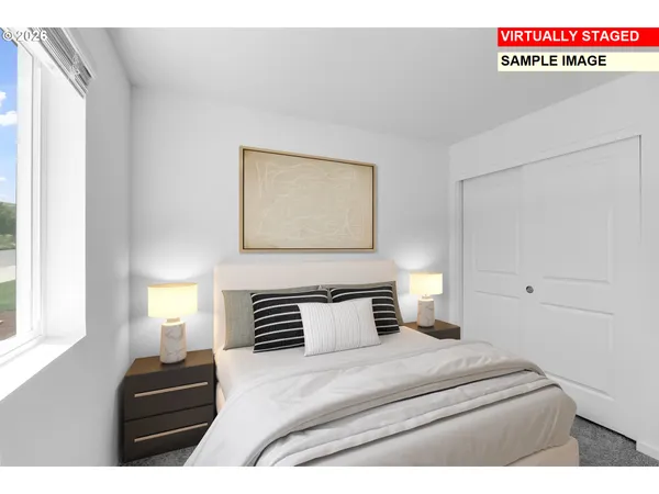 a bedroom with a bed and window