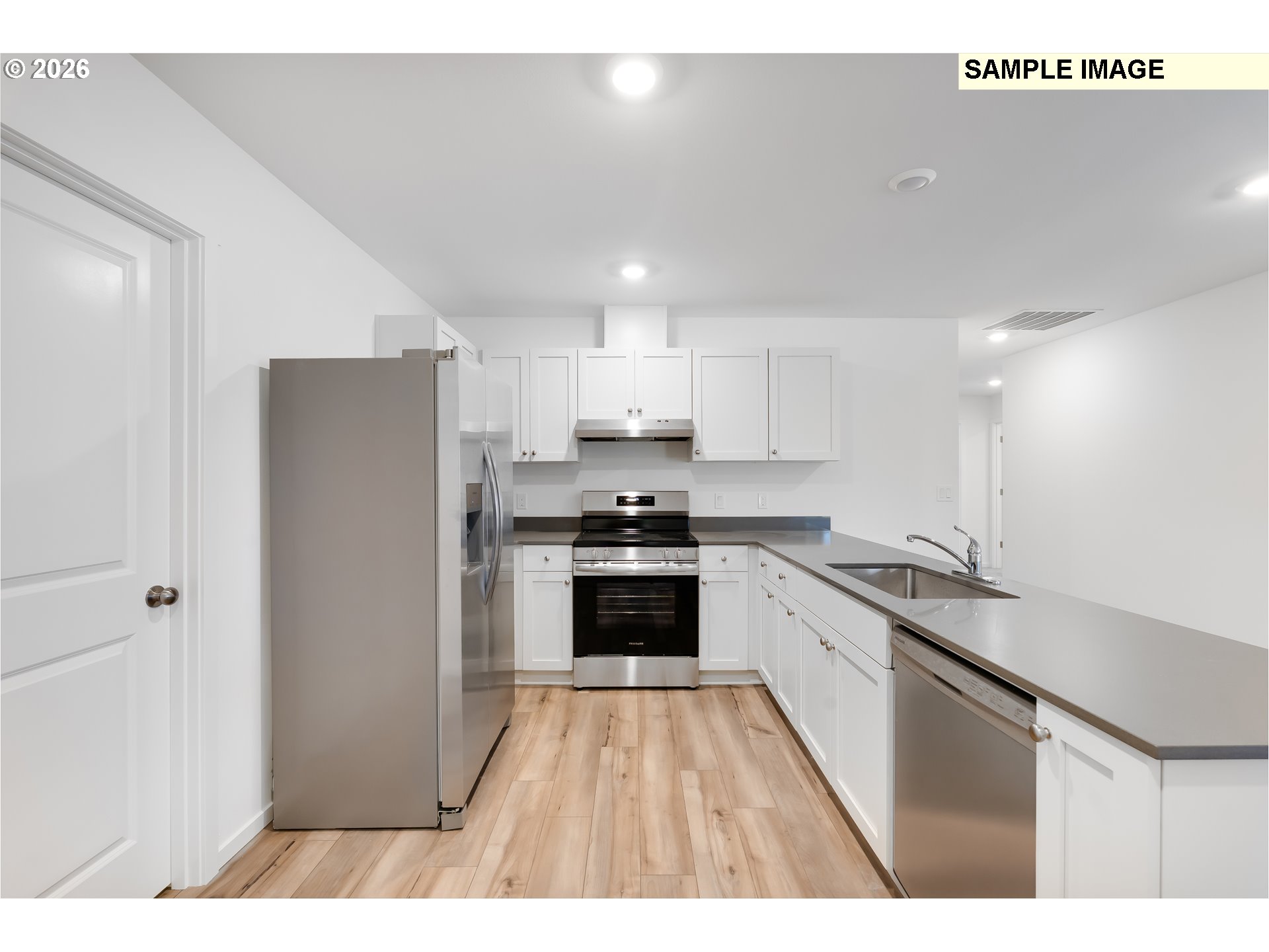 25255 Tanglewood Way Veneta, OR 97487 - Photo 4 of 47 a kitchen with stainless steel appliances a refrigerator sink and stove