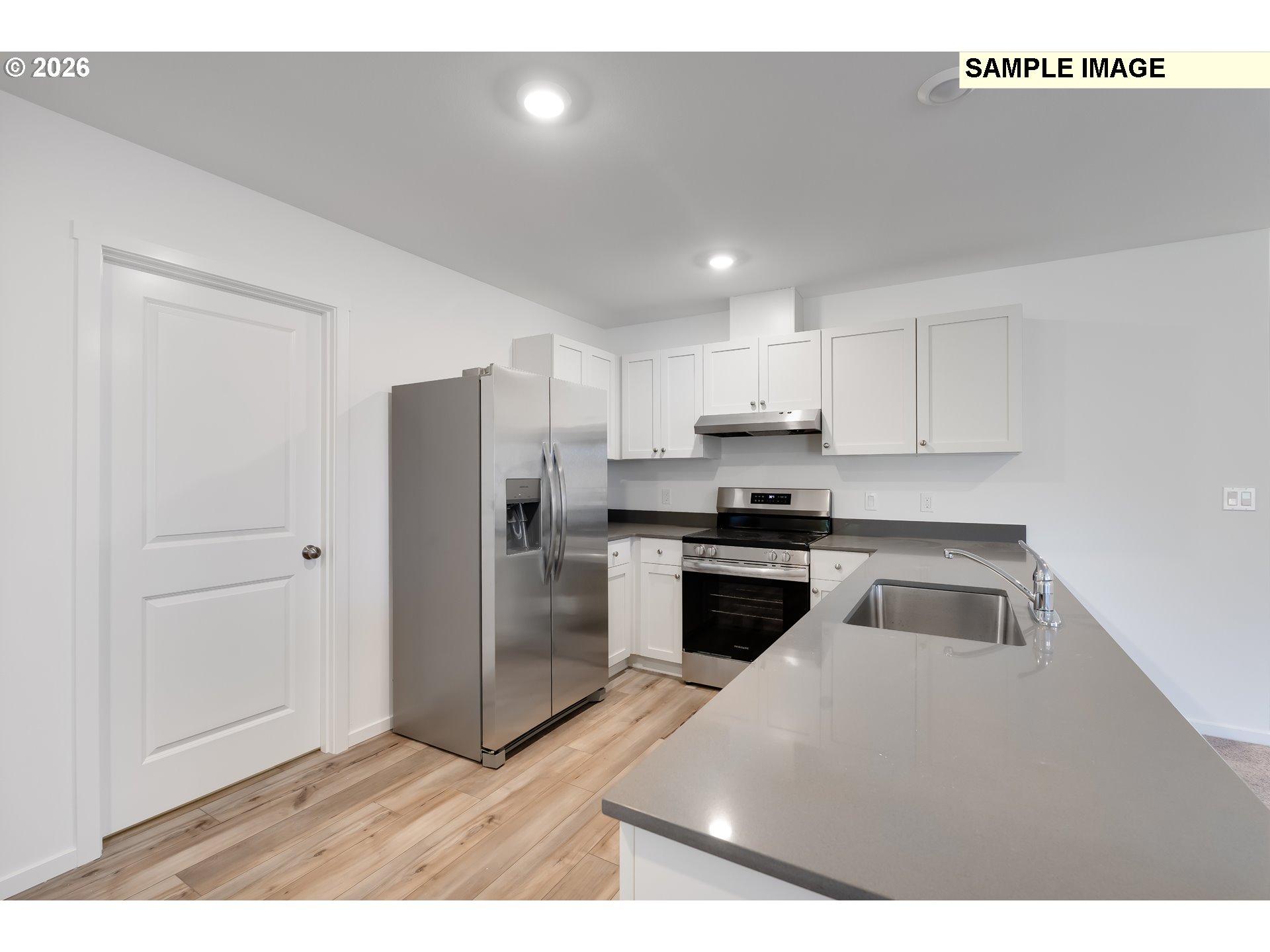25255 Tanglewood Way Veneta, OR 97487 - Photo 7 of 47 a kitchen with a refrigerator sink and cabinets