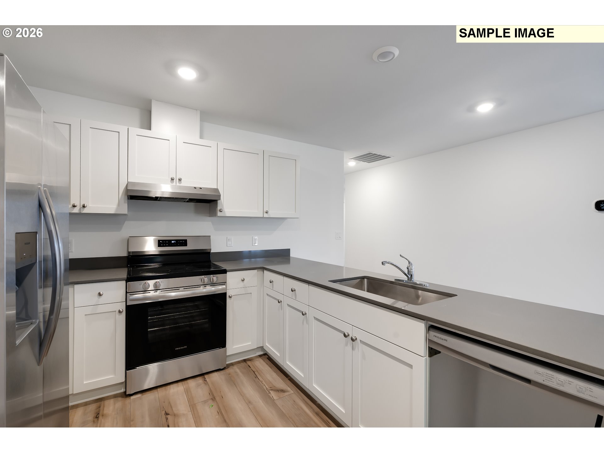 25255 Tanglewood Way Veneta, OR 97487 - Photo 9 of 47 a kitchen with stainless steel appliances granite countertop a sink stove and white cabinets