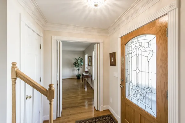 a view of a livingroom with furniture window and wooden floor