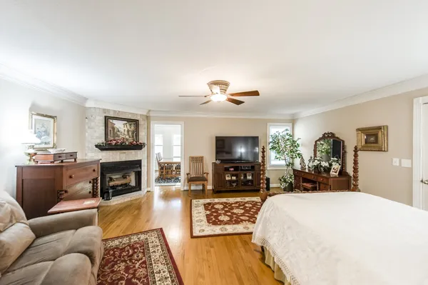 a view of a dining room with furniture wooden floor and a chandelier