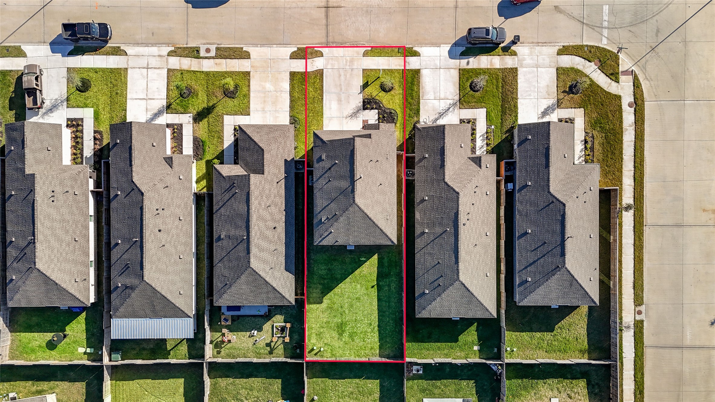 1111 Rustic Willow Drive Beasley, TX 77417 - Photo 40 of 42 This aerial photo showcases a residential property, highlighted in red, situated in a neat row of houses. It features a spacious backyard, well-maintained landscaping, and a driveway leading to a sidewalk in a suburban neighborhood.
