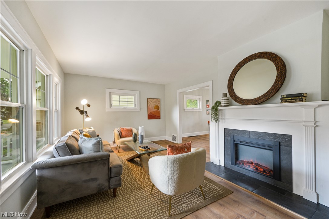 1606 Maple Road Cleveland Heights, OH 44121 - Photo 2 of 30 New luxury vinyl plank flooring throughout(2023).
Inviting foyer opens to the spacious, sun-filled living room with new fireplace