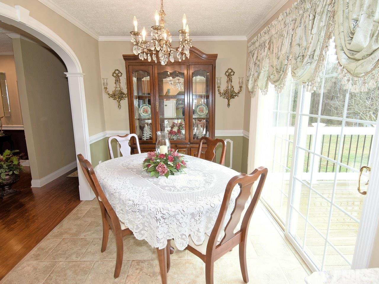 2004 Messer Road Raleigh, NC 27603 - Photo 7 of 28 a view of a dining room with furniture and wooden floor