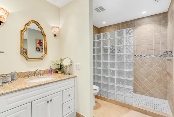 a bathroom with a double vanity sink mirror and