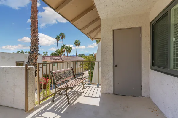 a view of balcony with furniture