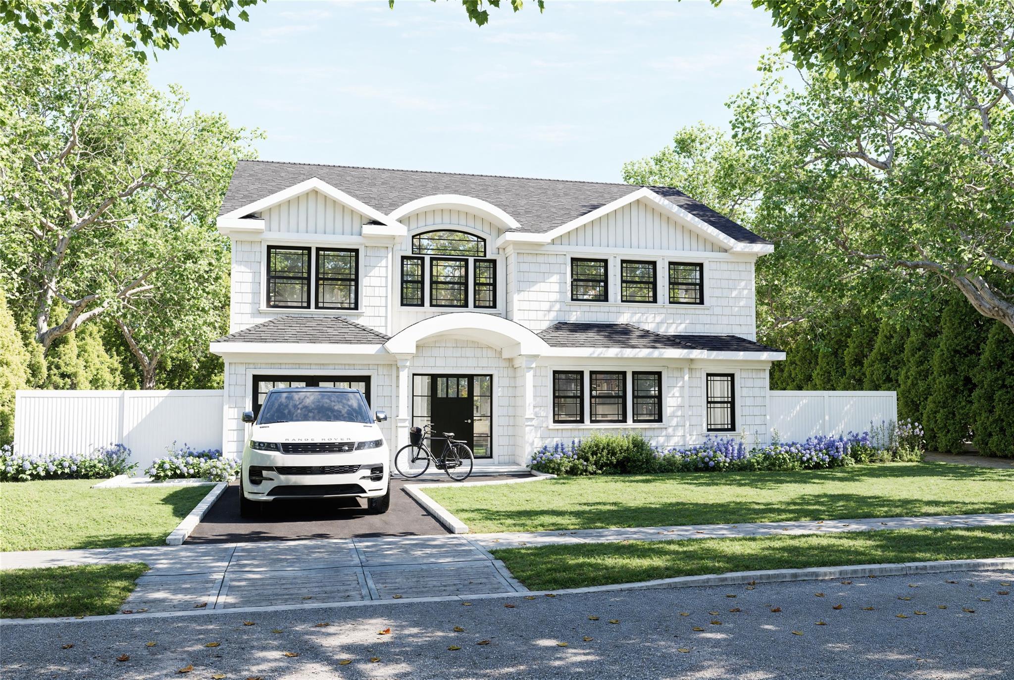 41 Preston Lane Syosset, NY 11791 - Photo 1 of 1 View of front of house featuring roof with shingles, concrete driveway, board and batten siding, and an attached garage