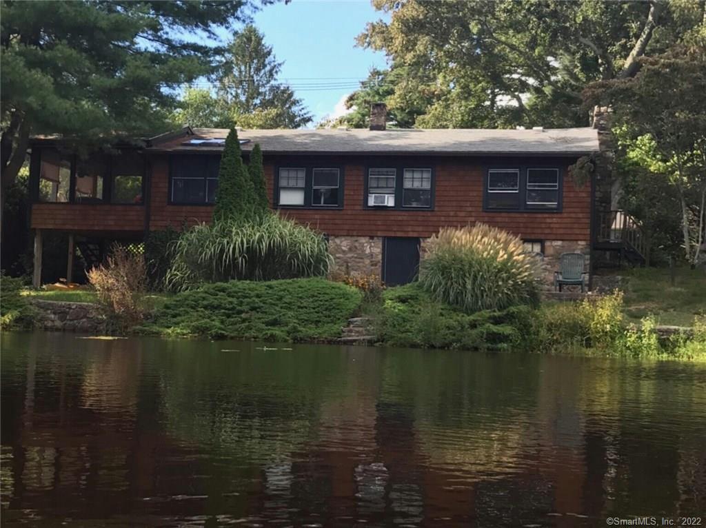 49 Beech Road Guilford, CT 06437 - Photo 1 of 1 a view of a house with a lake view