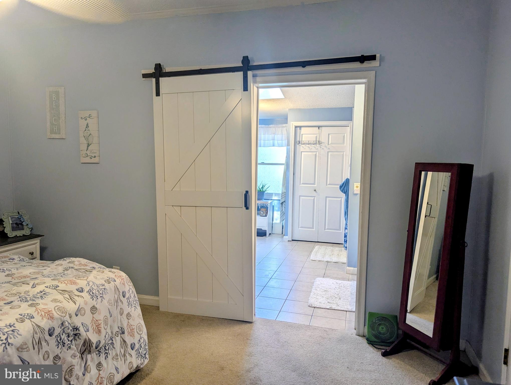 34693 Gunnel Road Millsboro, DE 19966 - Photo 29 of 64 Sliding Barn door to Primary Bath