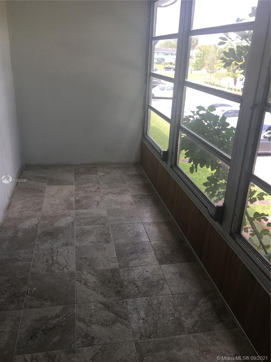 331 Farnham P, Unit 331 Deerfield Beach, FL 33442 - Photo 7 of 11 a view of an empty room with a window
