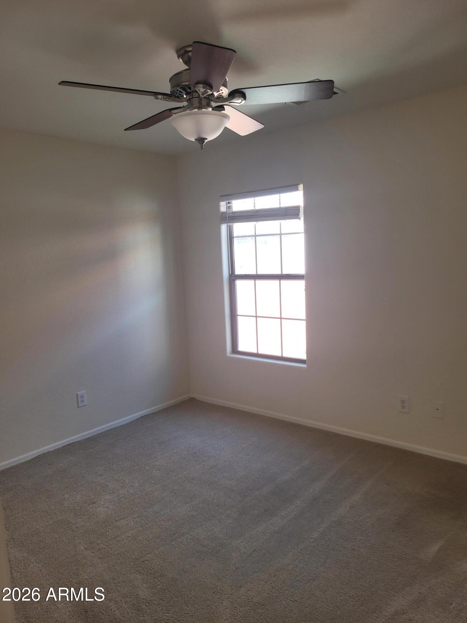 1453 South Sinova Avenue Gilbert, AZ 85296 - Photo 32 of 46 an empty room with a window