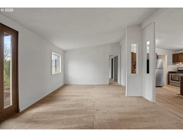 a view of a kitchen with a stove cabinets and wooden floor
