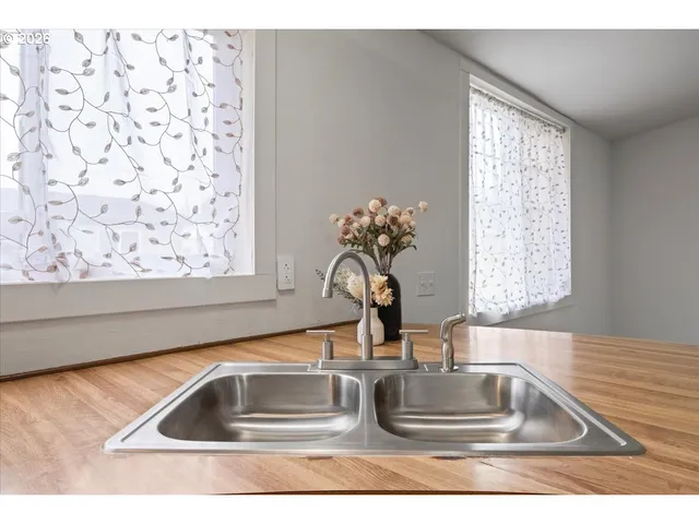 a kitchen with a refrigerator and a sink