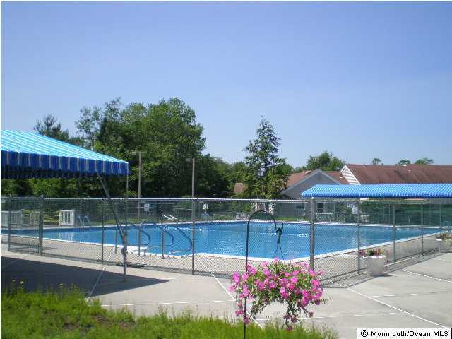 95 Halls Croft Road, Unit A Freehold, NJ 07728 - Photo 11 of 15 a view of a tennis court