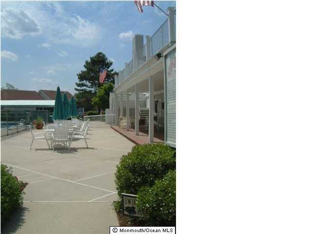 95 Halls Croft Road, Unit A Freehold, NJ 07728 - Photo 14 of 15 a view of a patio with couches and potted plants