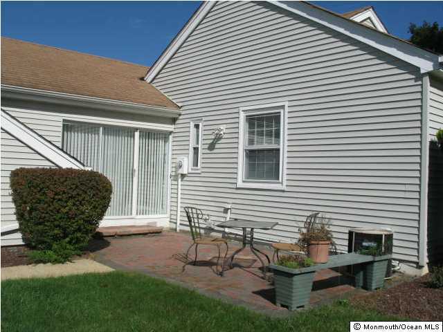 95 Halls Croft Road, Unit A Freehold, NJ 07728 - Photo 8 of 15 a view of a two chairs in front of house