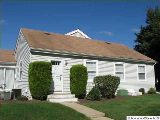 95 Halls Croft Road, Unit A Freehold, NJ 07728 - Photo 9 of 15 a front view of a house with garden