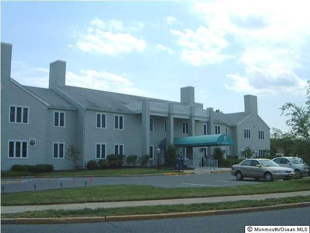 95 Halls Croft Road, Unit A Freehold, NJ 07728 - Photo 10 of 15 a view of multiple houses with a yard