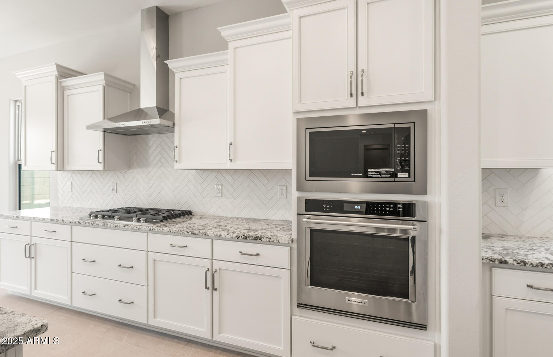 7836 West Mockingbird Way Florence, AZ 85132 - Photo 14 of 37 a kitchen with granite countertop white cabinets and stainless steel appliances