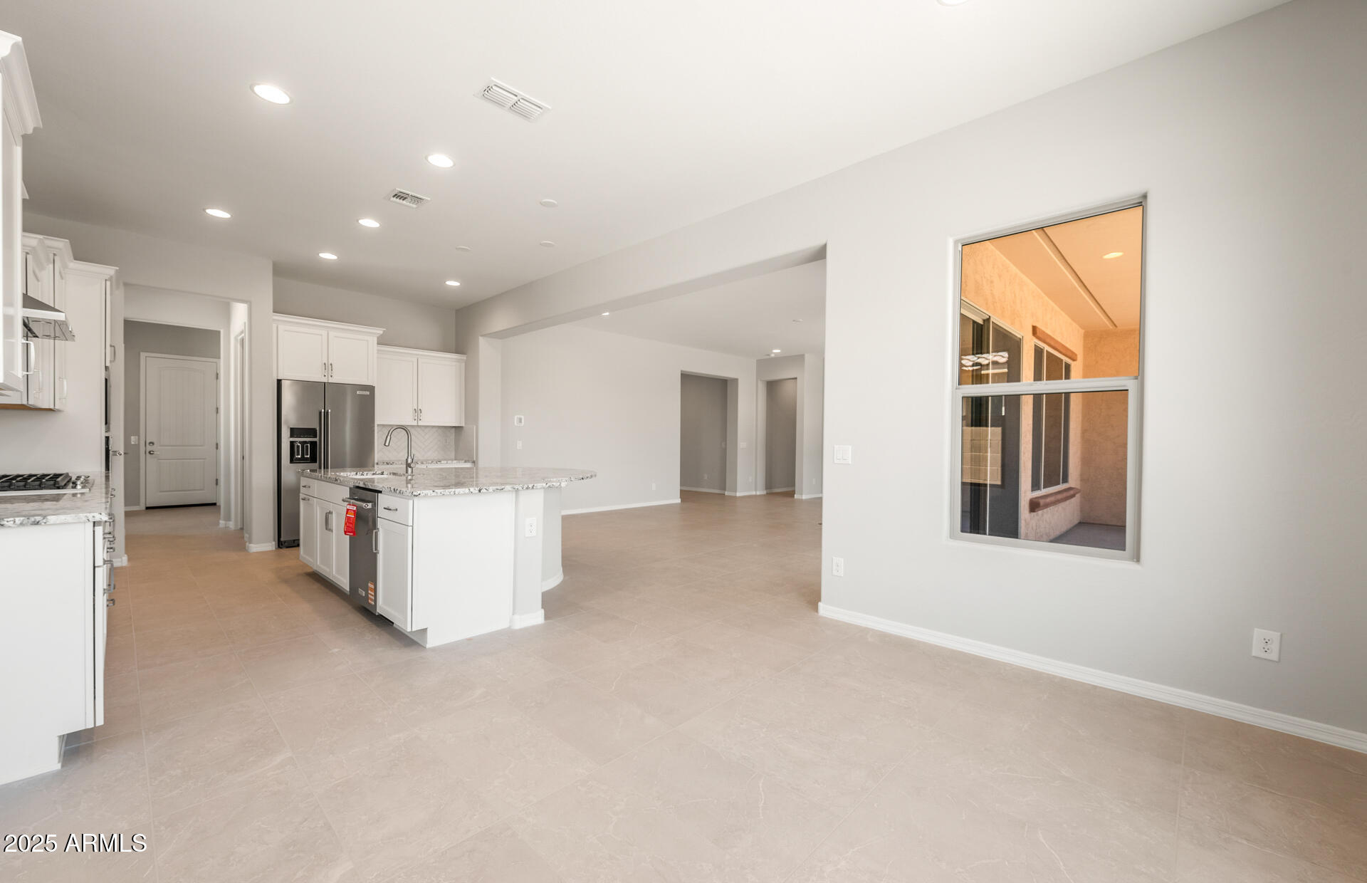 7836 West Mockingbird Way Florence, AZ 85132 - Photo 19 of 37 a view of kitchen with furniture and refrigerator