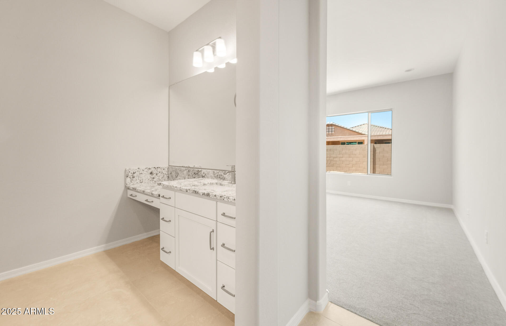 7836 West Mockingbird Way Florence, AZ 85132 - Photo 20 of 37 a bathroom with a sink a mirror and a vanity