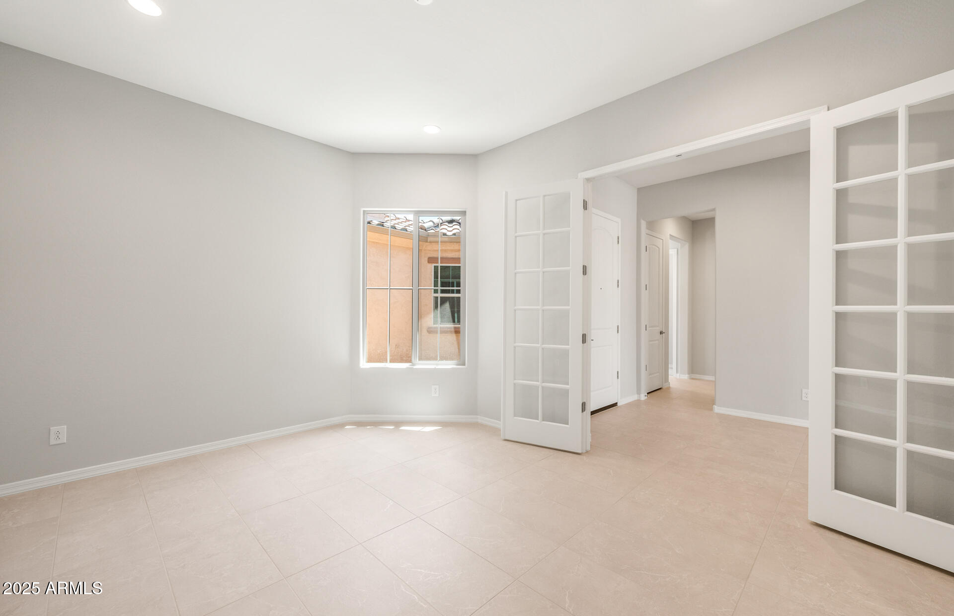 7836 West Mockingbird Way Florence, AZ 85132 - Photo 2 of 37 an empty room with windows