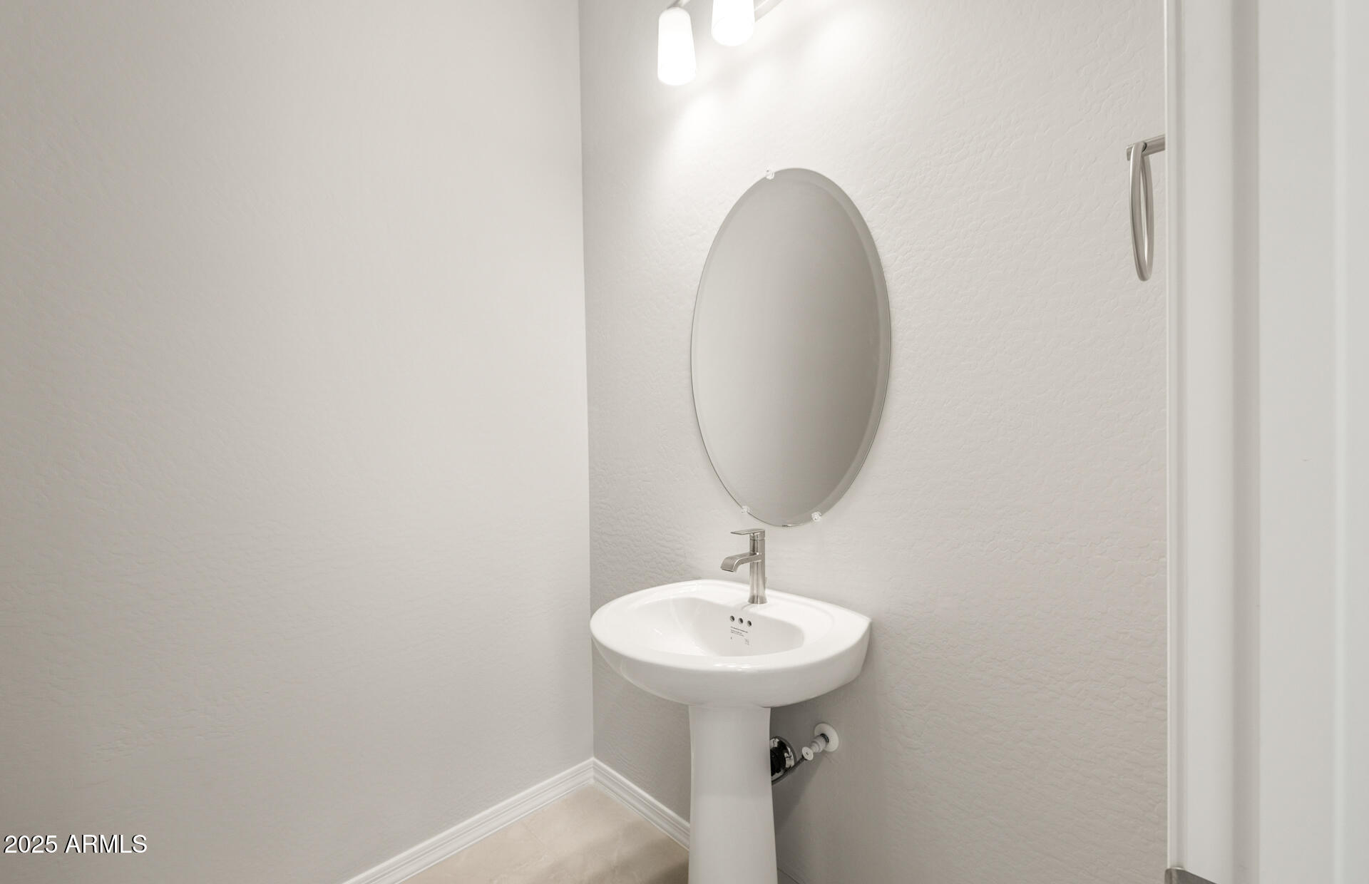 7836 West Mockingbird Way Florence, AZ 85132 - Photo 6 of 37 a bathroom with a sink and mirror