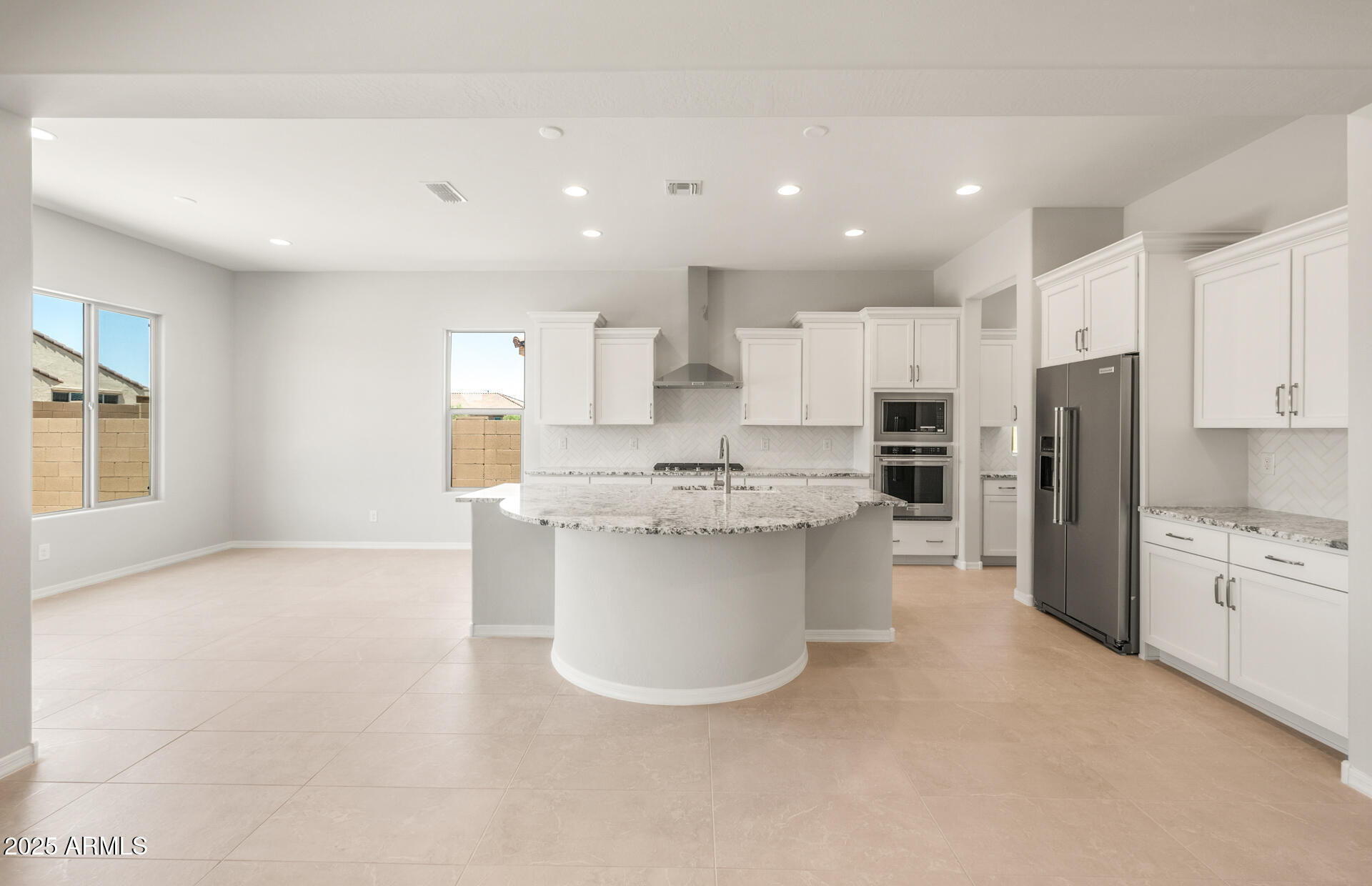 7836 West Mockingbird Way Florence, AZ 85132 - Photo 10 of 37 a kitchen with stainless steel appliances a refrigerator sink and stove