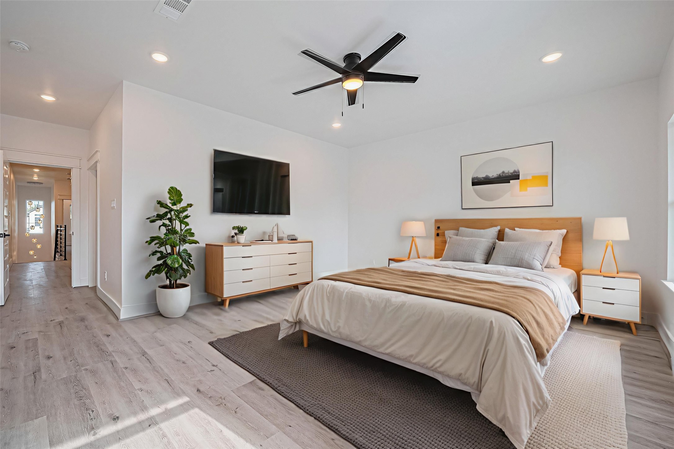 6747 Liverpool Street Houston, TX 77021 - Photo 4 of 18 This light-filled primary bedroom features soaring ceilings and an ensuite bath, creating a serene and luxurious retreat. **This room has been virtually staged.