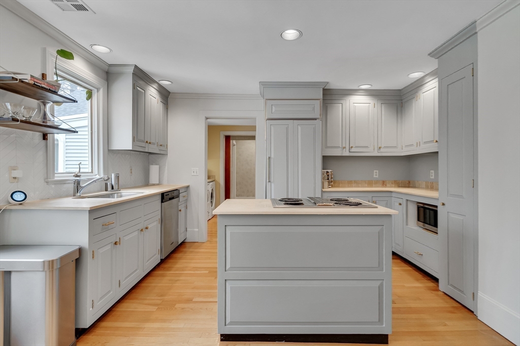 215 Mossman Road Sudbury, MA 01776 - Photo 13 of 30 a kitchen with a stove top oven and sink