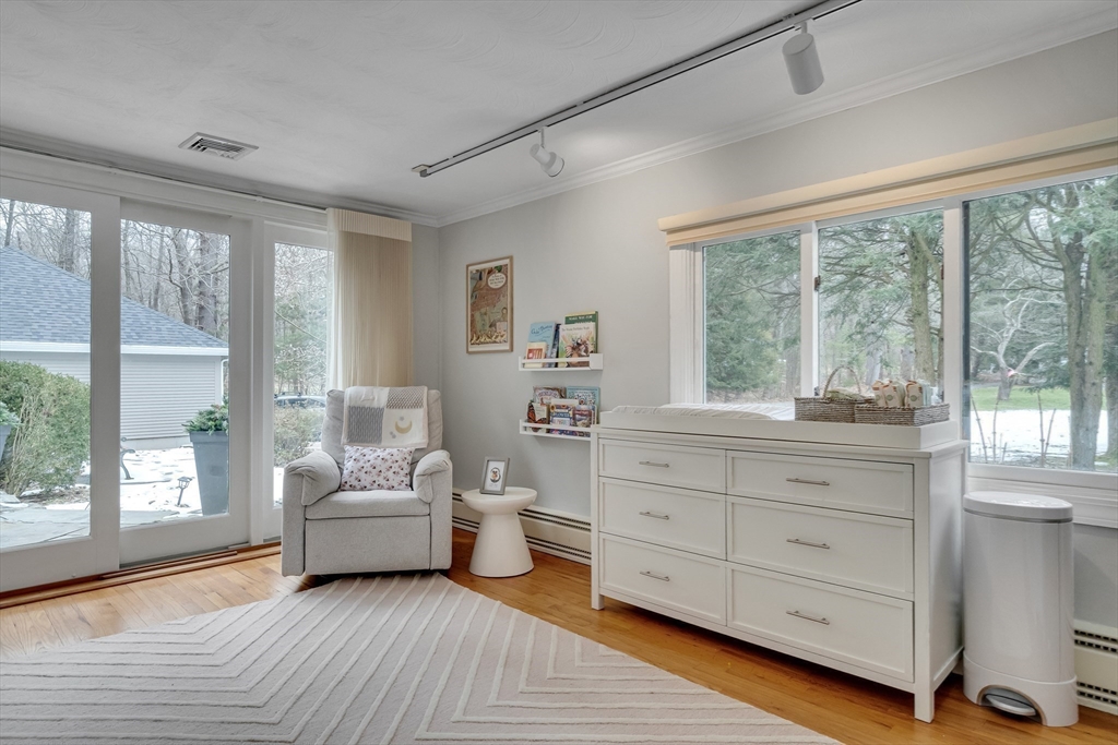 215 Mossman Road Sudbury, MA 01776 - Photo 14 of 30 a view of a bedroom with furniture and windows