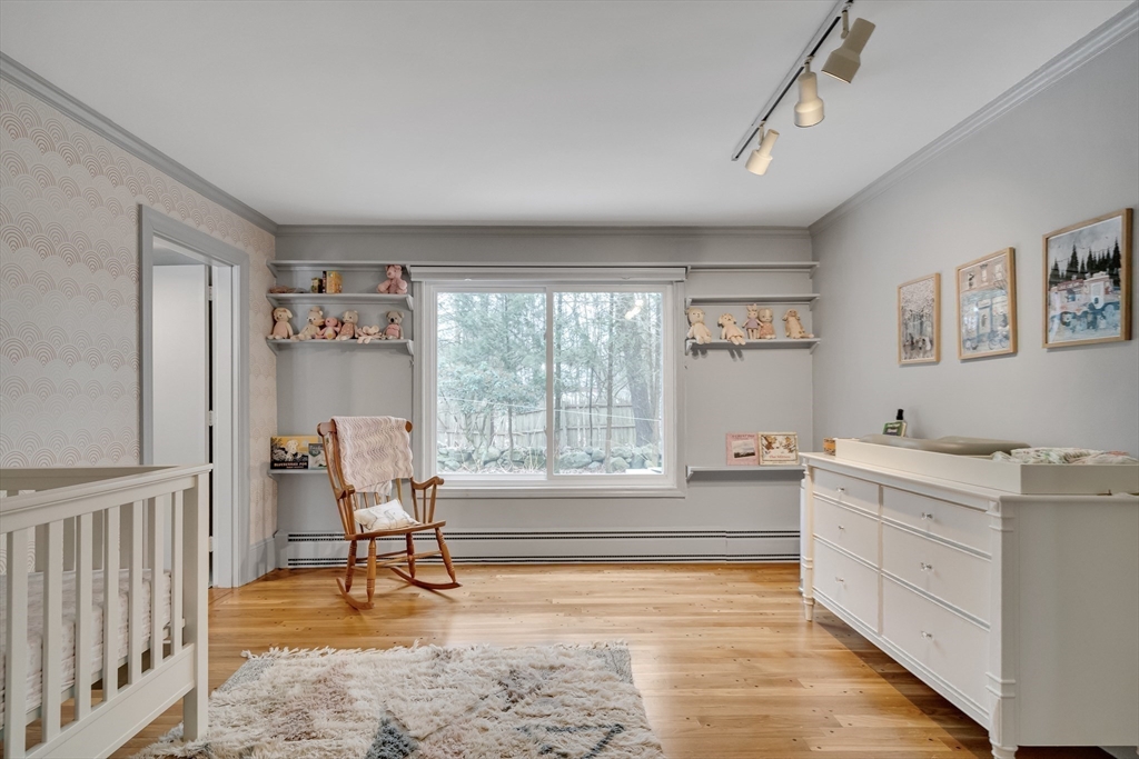 215 Mossman Road Sudbury, MA 01776 - Photo 15 of 30 a living room with a couch and a table