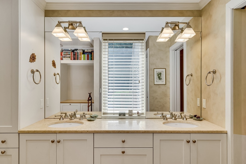 215 Mossman Road Sudbury, MA 01776 - Photo 16 of 30 a bathroom with a sink and a mirror